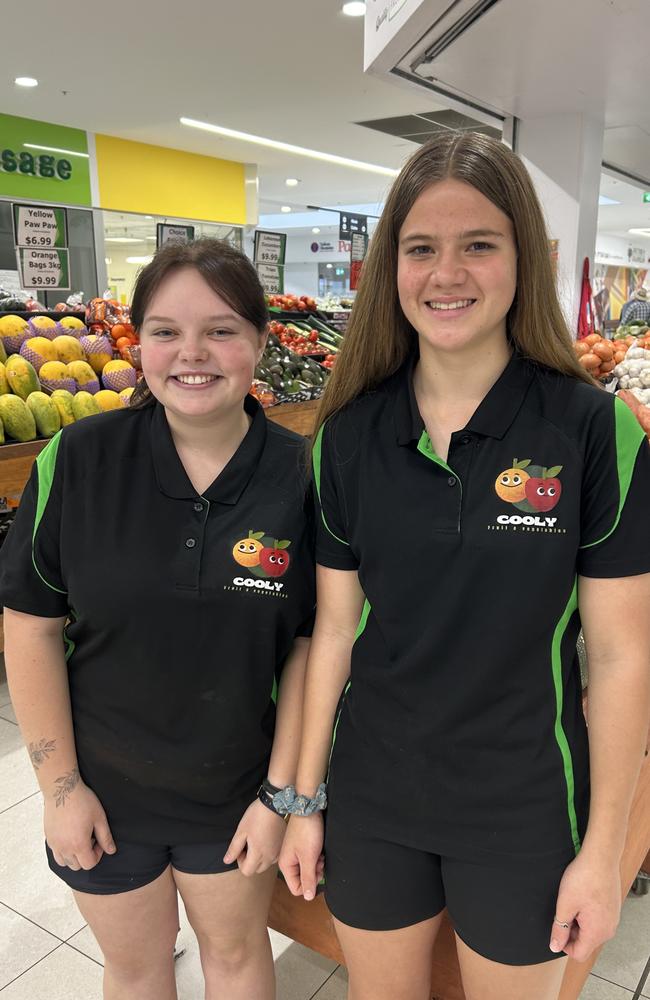 Cooly Fruit workmates Emily Groves (left) and Georgia Walters at work at Goldfields Plaza in GYmpie. The two workmates get along well and have made a Tik Tok video that has so far generated 3.8 million views, followers, comments, shares and posts.