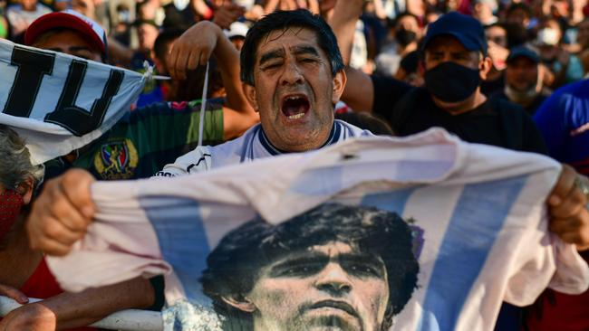 Fans gather outside the morgue where the late Argentine football star Diego Maradona's body will undergo an autopsy. Picture: AFP