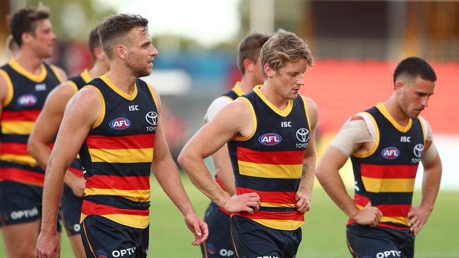 Crows players leave the field after their fifth consecutive loss of the 2020 season against, this time going down by 20 points to Fremantle. Picture: Chris Hyde/Getty Images