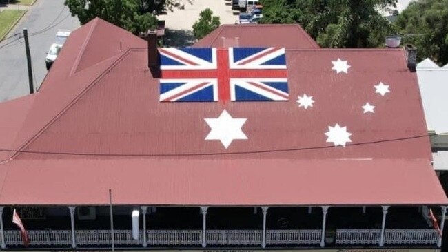 The Australian Red Ensign flag, an anti-vax symbol, fixed to the roof of The Caledonian Hotel Singleton. Picture: Facebook