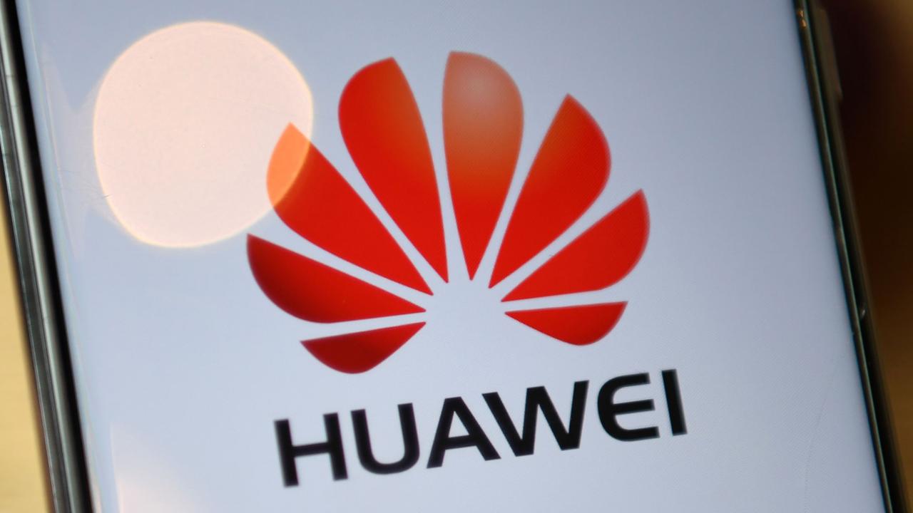 The logo of Chinese company Huawei. (Photo by DANIEL LEAL-OLIVAS / AFP)