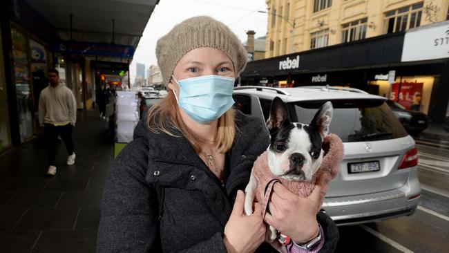 Kate Nelson has started wearing a face mask in public, including when she's walking their dog Roxie along Chapel Street. Picture: Andrew Henshaw