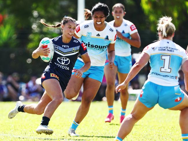 Krystal Blakwell breaks through the Titan's defensive line in the NRLW pre season match between the North Queensland Cowboys women and the Gold Coast Titans women's team, held at Alley Park, Gordonvale. Picture: Brendan Radke