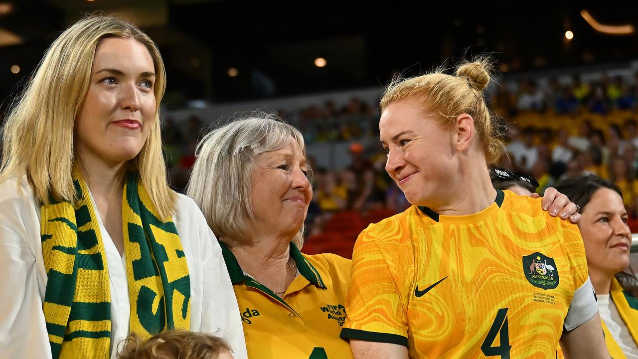 Clare Polkinghorne (right) with her mother, Britha (middle) at her Brisbane send-off last week – which has turned out to be her penultimate appearance in green and gold. Picture: Albert Perez / Getty Images