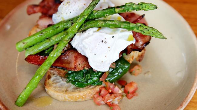 'Manhattan Mix has poached eggs, bacon, wilted spinach, grilled asparagus and tomato salsa. Pictures: Troy Snook