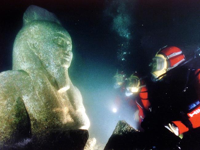 An underwater archaeologist comes face to face with a large statue of the God Hapi — the god of flooding — discovered in front of the major dynastic temple dedicated to Khonsu-Herakles and part of the sunken city of Heracleion in Alexandria.