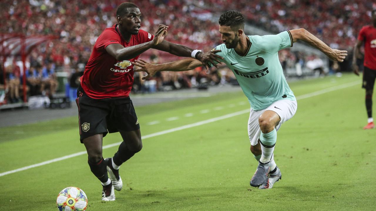 Manchester United's Paul Pogba (L) in action this pre-season. (AP Photo/Danial Hakim)