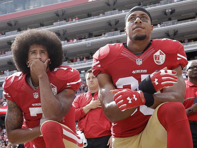 FILE - In this Oct. 2, 2016, file photo, San Francisco 49ers quarterback Colin Kaepernick, left, and safety Eric Reid kneel during the national anthem before an NFL football game against the Dallas Cowboys in Santa Clara, Calif. The Carolina Panthers have signed the free agent safety to a one-year contract. Terms of the deal were not announced Thursday, Sept. 27, 2018. (AP Photo/Marcio Jose Sanchez, File)