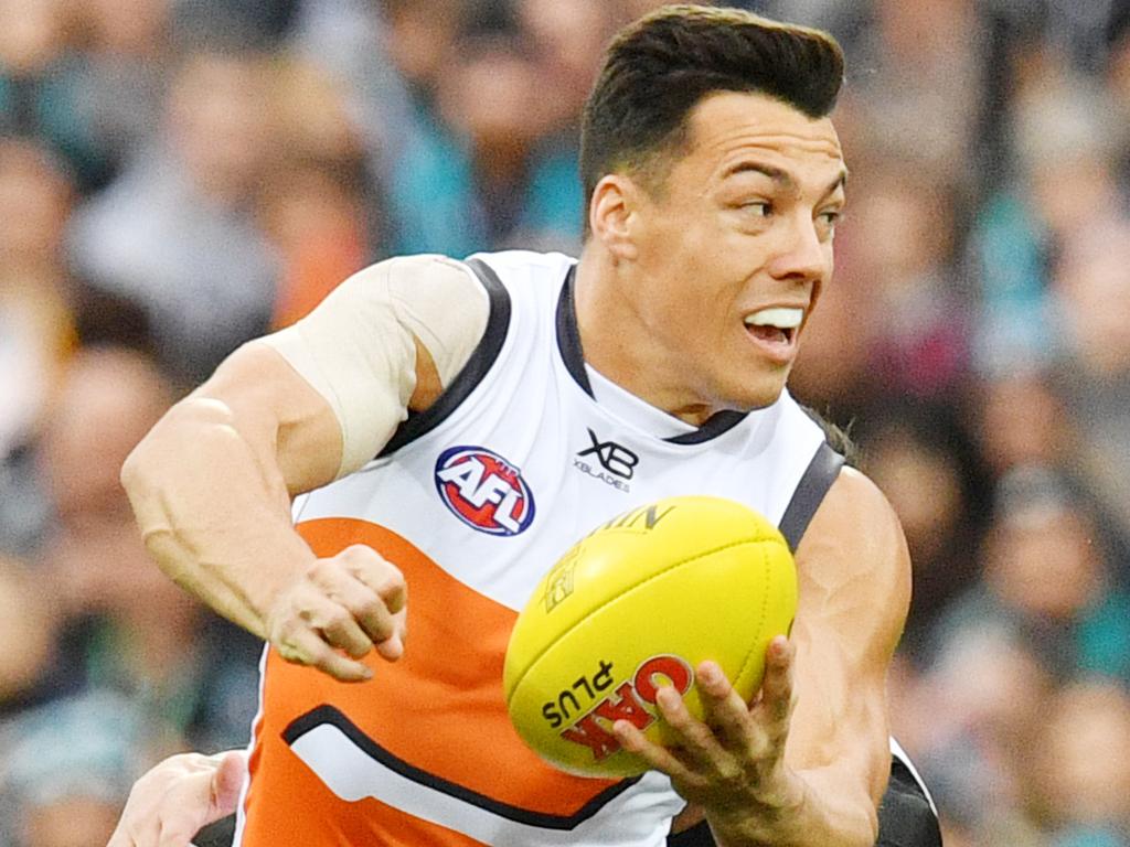 Dylan Shiel of the Giants is tackled by Chad Wingard of the Power during the Round 18 AFL match between the Port Adelaide Power and the Greater Western Sydney (GWS) Giants at Adelaide Oval in Adelaide, Sunday, July 22, 2018. (AAP Image/David Mariuz) NO ARCHIVING, EDITORIAL USE ONLY