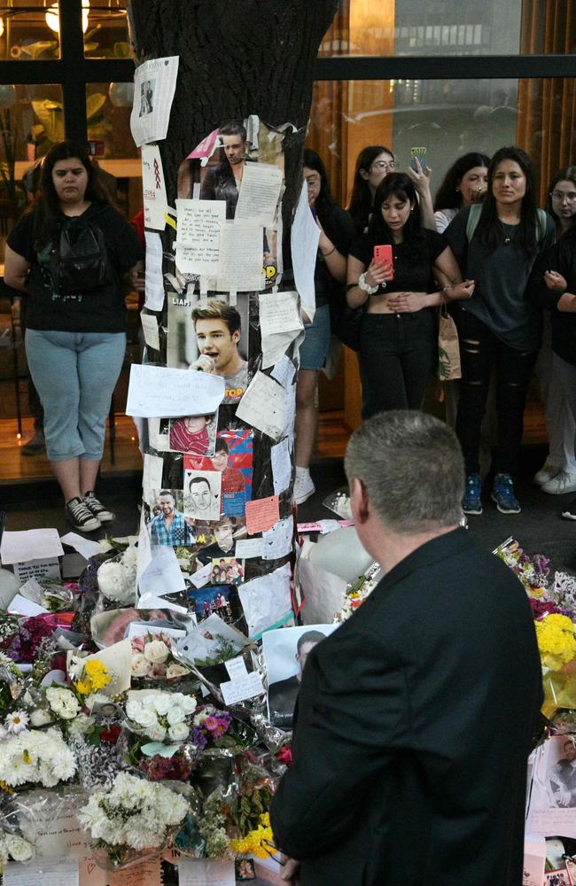 Geoff Payne, the father of One Direction pop singer Liam Payne, looks at the place where fans paid tribute to his late son outside the CasaSur Hotel in Buenos Aires. Picture: AFP