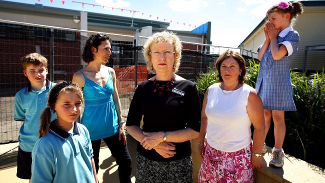 Principal Deborah Grossek, centre, with parents Kerri-anne Hall, left, and Helen Bunn and students at Glendal Primary School. Picture: Aaron Francis