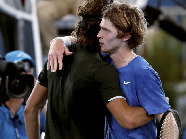 Harris (left) congratulates Rublev on his win. Picture: AP