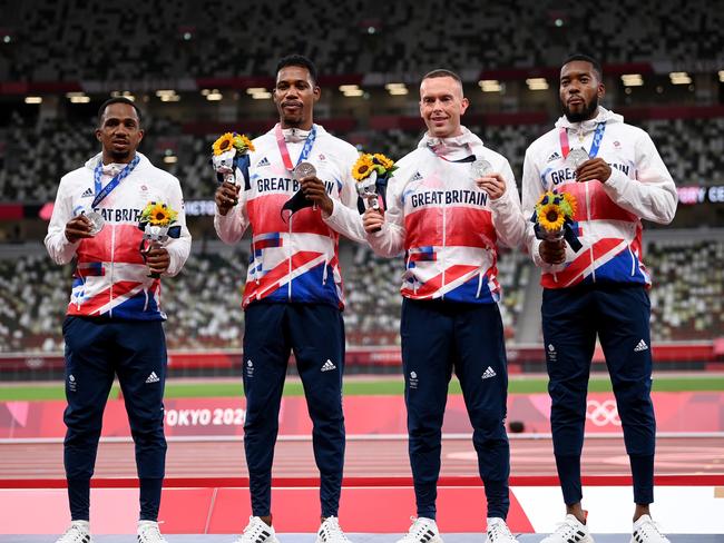 TOKYO, JAPAN - AUGUST 07:  Silver medal winners CJ Ujah, Zharnel Hughes, Richard Kilty and Nethaneel Mitchell-Blake of Team Great Britain stand on the podium during the medal ceremony for the Men's 4 x 100m Relay on day fifteen of the Tokyo 2020 Olympic Games at Olympic Stadium on August 07, 2021 in Tokyo, Japan. (Photo by Matthias Hangst/Getty Images)