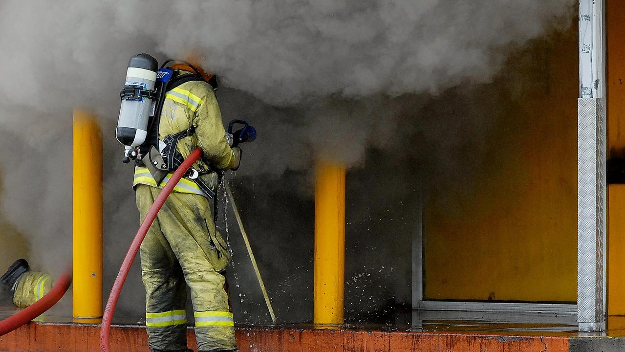 Firefighters stopped the blaze from spilling over a fire-rated wall saving half of the entire building. Picture: Tony Martin