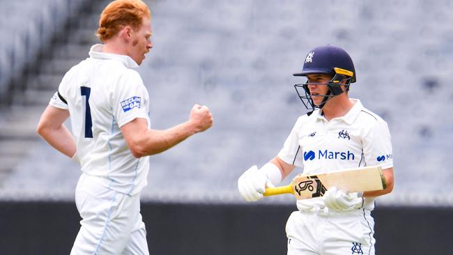 Victoria's batsman Marcus Harris holds his broken bat as he is dismissed by New South Wales bowler Liam Hatcher during their Sheffield Shield match in Melbourne on November 5, 2021. (Photo by William WEST / AFP)