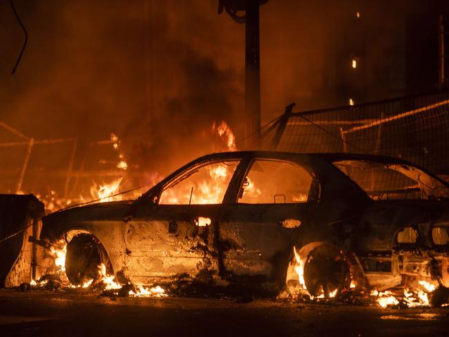 A car burns near the Third Police Precinct in Minneapolis. Picture: AFP