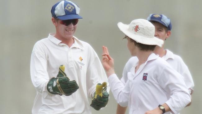 Norths slips fielder Alexander Machin is congratulated by wicketkeeper Ben Dunk after catching Lord Taverners opening batter Jason Johnston.