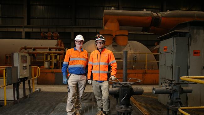 Markus Brokhof, Chief Operating Officer AGL with Brad Williams, site transition manager pictured together in the old turbine hall of Liddell power station.