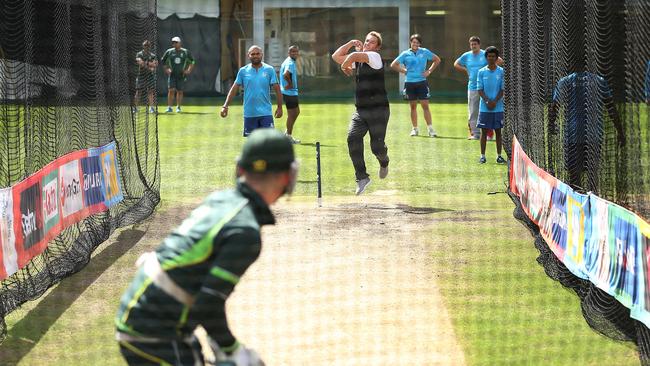 Australian captain Michael Clarke faces Shane Warne in the nets during training at the SCG ahead of tomorrow nights World Cup Semi against India. pic. Phil Hillyard