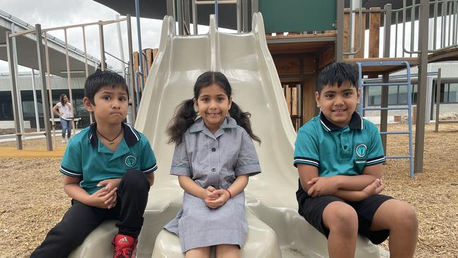 Students Reyu, Sayesha and Divit, 6, enjoyed checking out the playground on their first day. (Picture: Olivia Condous