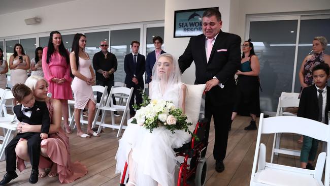 Ashleigh Simrajh being taken down the aisle by father Tony, at Sea World Resort. Photograph: Jason O'Brien