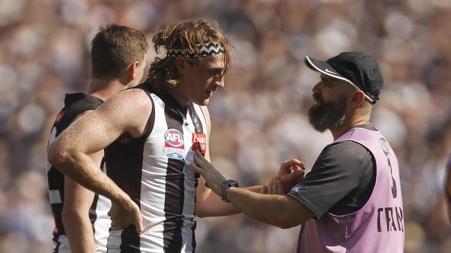 Nathan Murphy leaves the field with trainers. Picture: Daniel Pockett/AFL Photos/via Getty Images