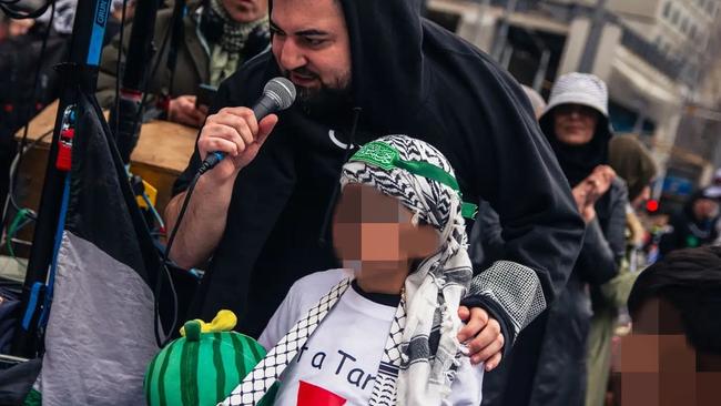 Burgertory boss Hash Tayeh with child wearing Hamas-style headband at a pro-Palestine rally on Sunday, July 21. Picture: Wardenclyffe Photography