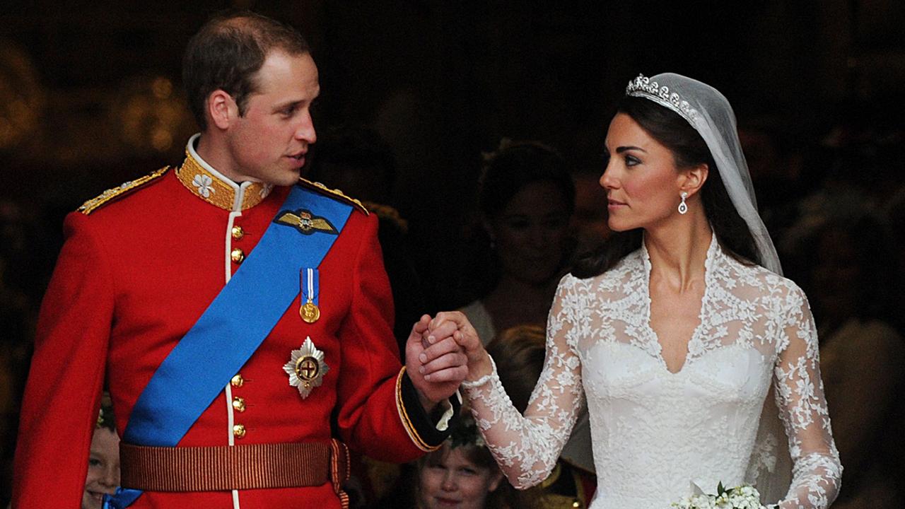 Britain's Prince William and his wife Kate, Duchess of Cambridge, look at each other as they come out of Westminster Abbey following their wedding ceremony. Picture: Carl De Souza/ AFP