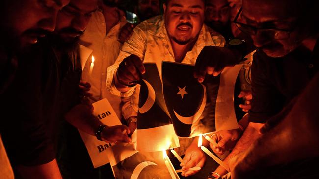 Protesters in India burn Pakistan's national flag. Picture: Biju BORO / AFP