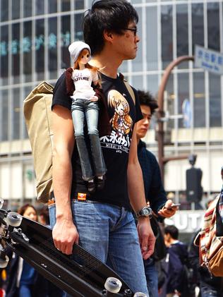 Choo with his Smart Doll which can be controlled by a smartphone.