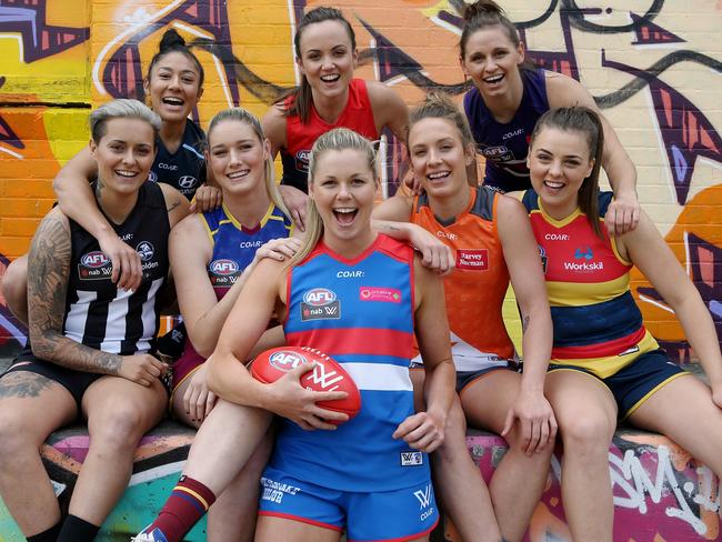 AFL Women’s players parade next season’s jumpers: Katie Brennan (Western Bulldogs), Ebony Marinoff (Adelaide), Tayla Harris (Brisbane Lions), Darcy Vescio (Carlton), Moana Hope (Collingwood), Emma Swanson (GWS), Kara Donnellan (Fremantle) and Melbourne’s Daisy Pearce. Picture: Wayne Ludbey