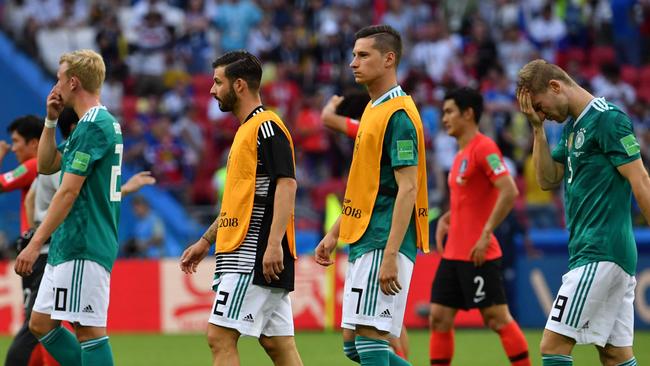 Germany's team players react after losing the Group F football match against South Korea. Picture: AFP.