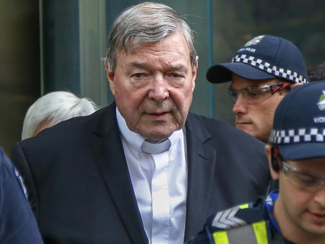 FILE - In this May 2, 2018, file photo, Cardinal George Pell, the most senior Catholic cleric to face sex charges, leaves court in Melbourne, Australia. Pell was sentenced in an Australian court on Wednesday, March 13, 2019 to 6 years in prison for molesting two choirboys in a Melbourne cathedral more than 20 years ago.  (AP Photo/Asanka Brendon Ratnayake, File)