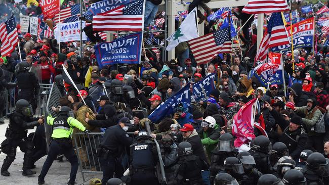 Trump supporters clash with police and security forces outside the US Capitol in January. Picture: AFP