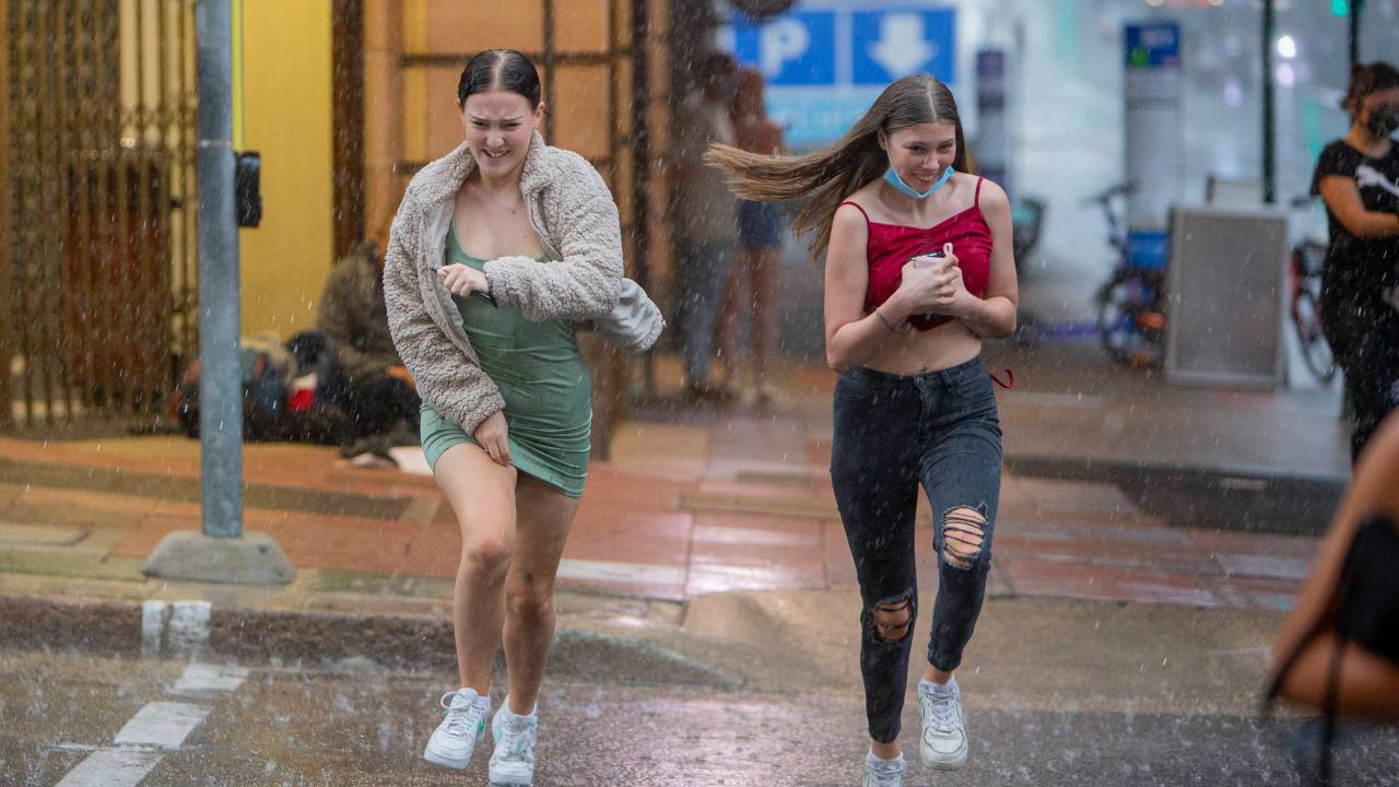 File image of pedestrians running for cover as a storm and rain hits the Brisbane CBD. Picture: Jerad Williams
