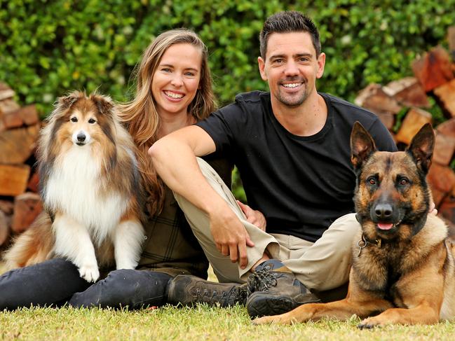 Dog behaviourists Ryan and Jen Tate with their dogs.