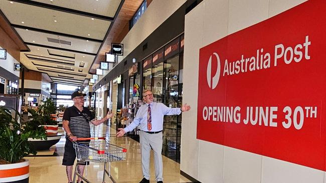 Coomera MP Michael Crandon, pictured with local Les Hargreaves, is celebrating Australia Post deciding to open a new post office in Pimpama. Picture: Supplied