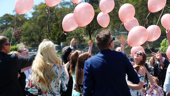 Pink balloons released after the funeral service. Picture: NIKKI DAVIS-JONES