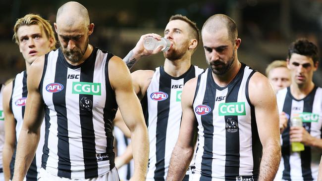 A dejected Ben Reid and Steele Sidebottom after the loss to Hawthorn.