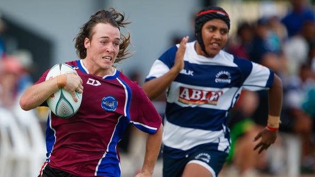 Swamp Dogs Jim Price runs in a try against Cougars to take out the under-17 title at rugby’s Hottest Sevens at Marrara. Picture: GLENN CAMPBELL