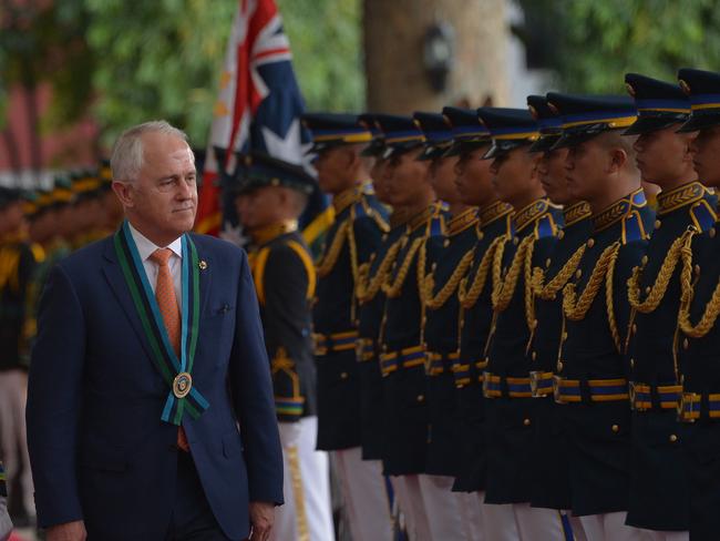 Warning shot ... Malcolm Turnbull reviews Philippine guard today. Picture: AFP