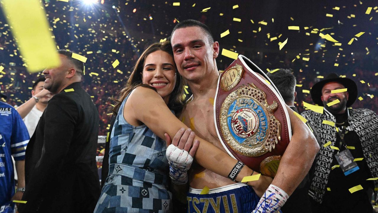 Tim Tszyu celebrates with his partner Alexandra Constantine. Photo by Saeed KHAN / AFP.