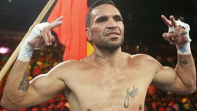 Two fingers to boxing? Anthony Mundine celebrates his TKO win over Shane Mosley after the sixth round.