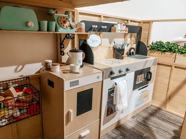 She reseized a Kmart kitchenette to fit inside the new cubby house. Picture: Supplied