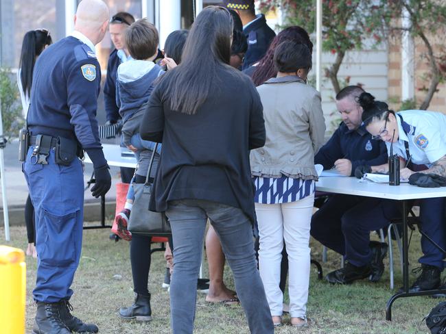 Corrective Services officers conduct drug searches with sniffer dogs on visitors at the Silverwater Correction Centre yesterday. Picture: Tim Hunter