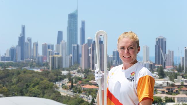 Games ambassador and athlete Sally Pearson with the Queens Baton looking over the Gold Coast. Picture Glenn Hampson