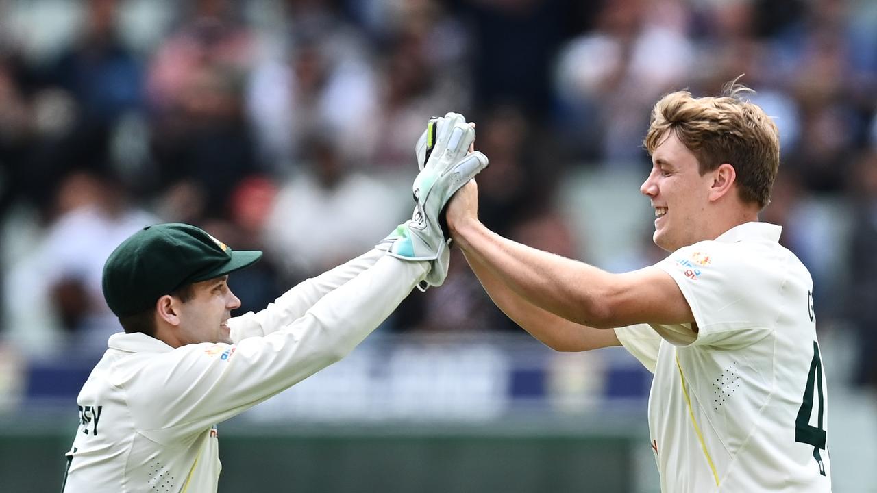 MELBOURNE, AUSTRALIA - DECEMBER 26: Cameron Green (R) of Australia celebrates with teammate Alex Carey after dismissing Ben Stokes of England during day one of the Third Test match in the Ashes series between Australia and England at Melbourne Cricket Ground on December 26, 2021 in Melbourne, Australia. (Photo by Quinn Rooney/Getty Images)