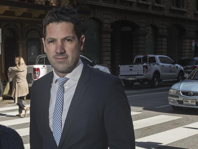 Adelaide City Councilors Anne Moran and Alex Antic walking over the pedestrian crossing on Pirie Street. Picture SIMON CROSS