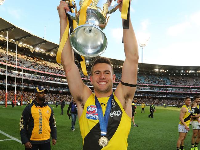 Jack Graham celebrates with the AFL Premiership Cup after Richmond won the 2017 AFL Grand Final. Picture: Scott Barbour/AFL Media/Getty Images