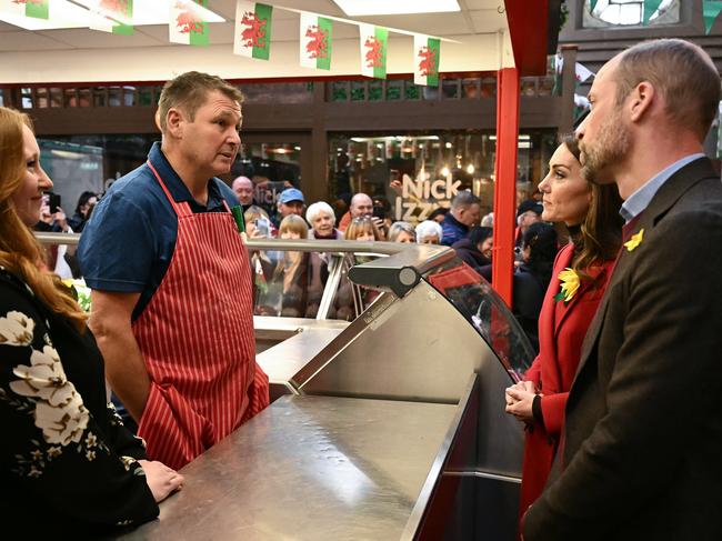 PCatherine, Princess of Wales and Prince William, Prince of Wales talk with Kevin Kidner, owner of Dewhurst Butchers during a visit to Pontypridd Market. Picture: Ben Stansall – WPA Pool/Getty Images